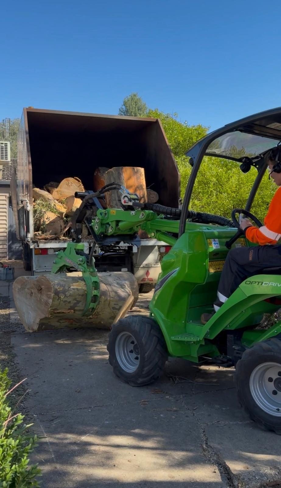 True Roots wood chipper and trucks on a Sydney roadside job
